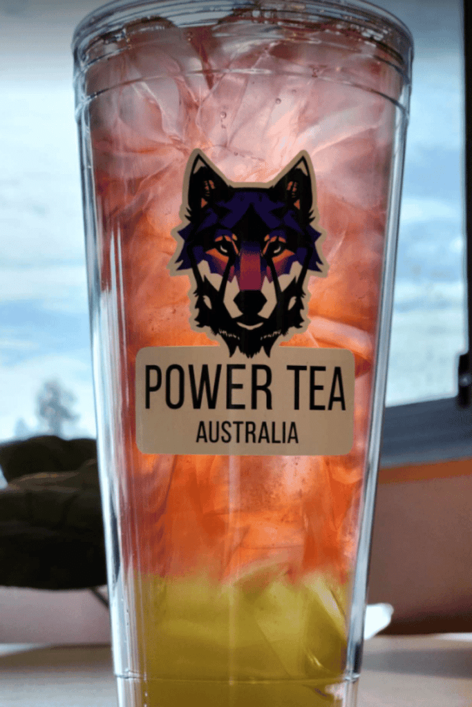 Picture of a cup of orange and yellow flavoured energy Power Tea.