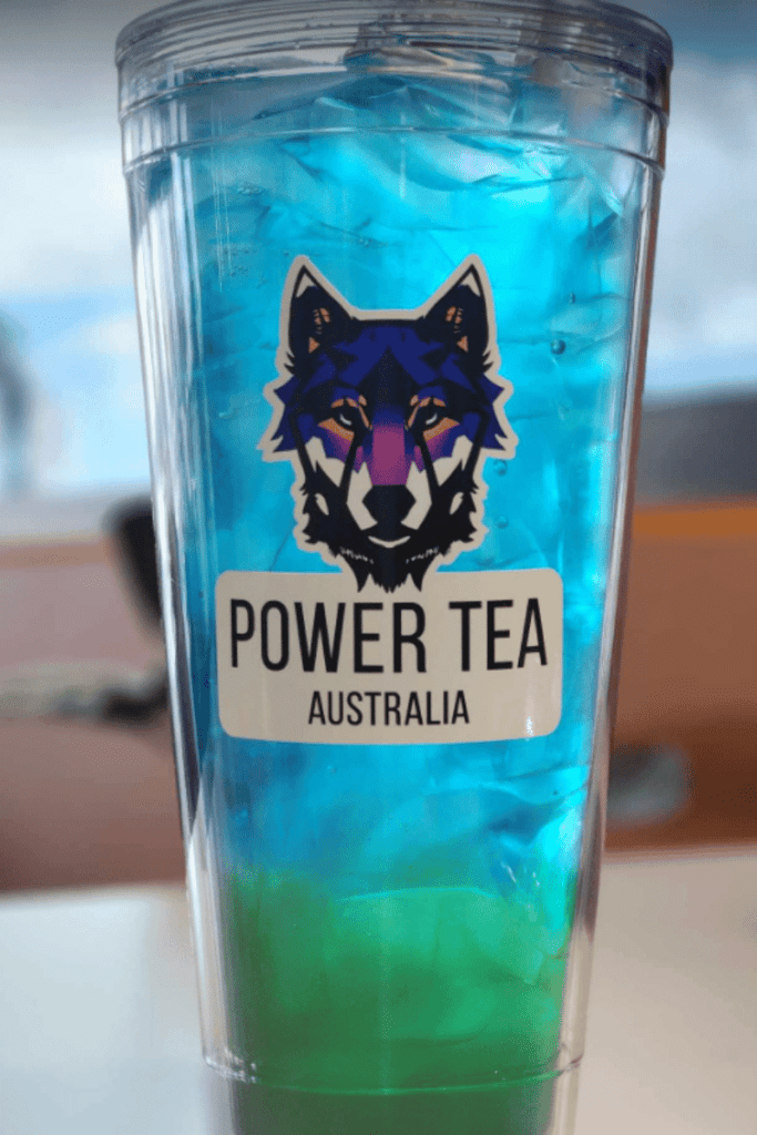 A cup of blue and green flavoured Power Tea in a tall 32oz clear cup.