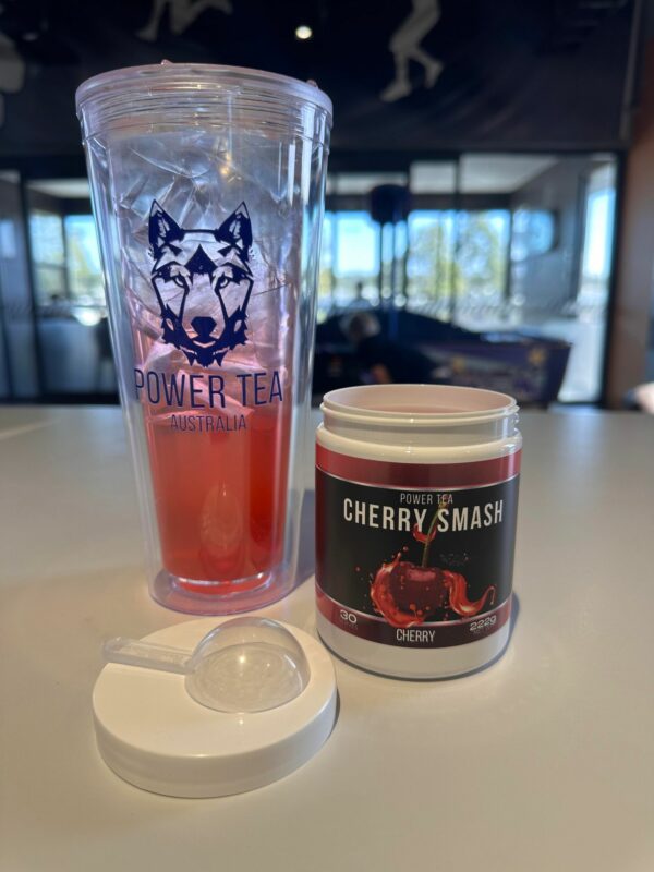 Power Cherry Smash drink mix in a 32oz clear cup with ice