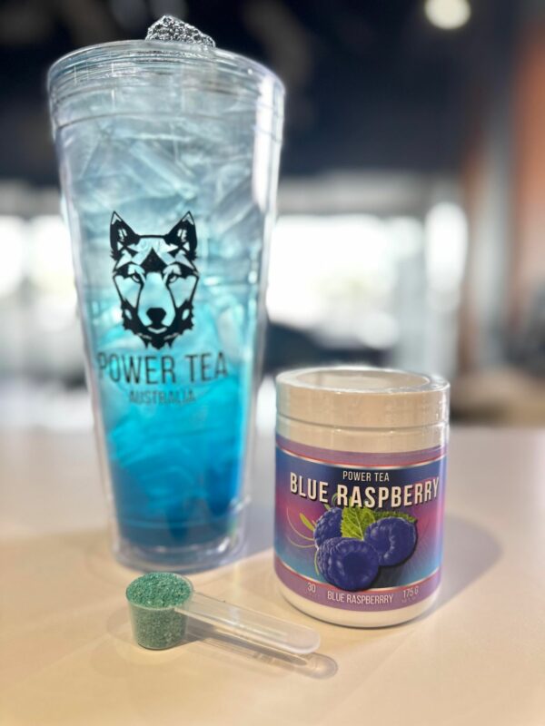 Power Tea Blue Raspberry drink mix in a 32oz clear cup with ice